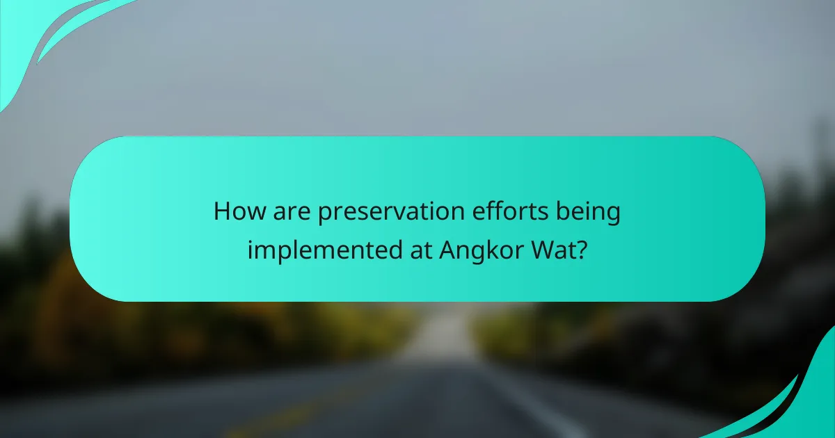 How are preservation efforts being implemented at Angkor Wat?